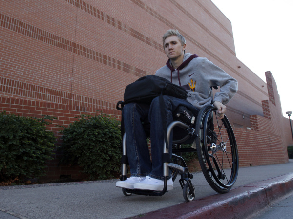 Former Mater Dei High School baseball star Cory Hahn as they makes his way to his macroeconomics class Tuesday, Jan. 17, 2012, in Tempe, Ariz. Hahn suffered a spinal cord injury while playing baseball as Arizona State University where he is a student.